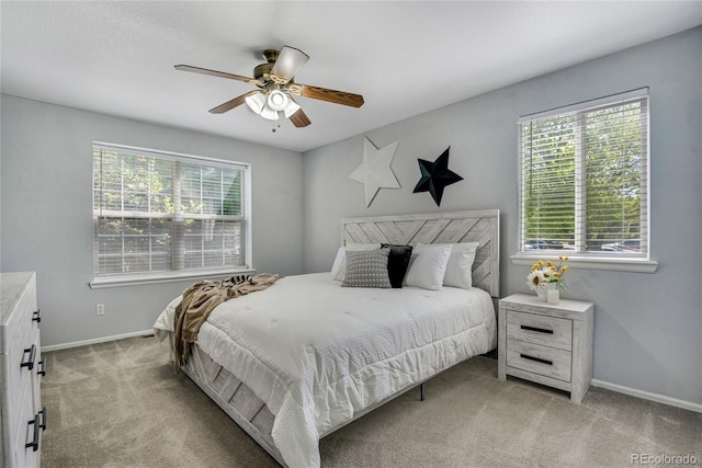 9080 Gale Blvd Unit 4, Thornton, CO 80260 - bedroom with multiple windows, light colored carpet, baseboards, and ceiling fan