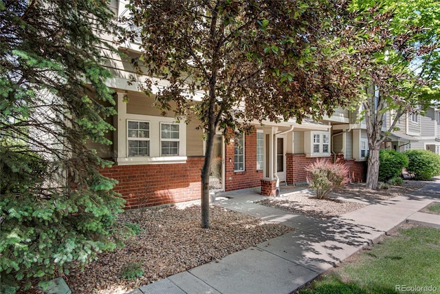 9080 Gale Blvd Unit 4, Thornton, CO 80260 - view of property hidden behind natural elements with brick siding