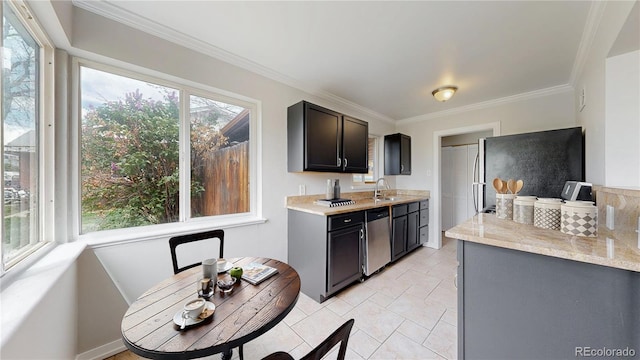 kitchen featuring light countertops, stainless steel appliances, and ornamental molding