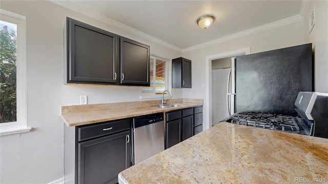 kitchen featuring stainless steel appliances, a sink, and crown molding
