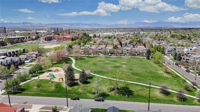 aerial perspective of suburban area with mountains and a community park