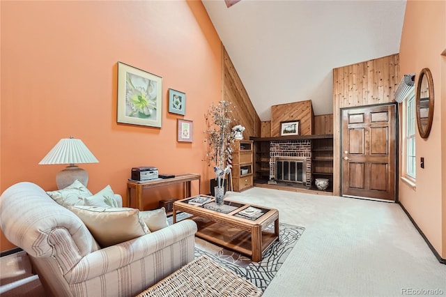 living room with carpet floors, high vaulted ceiling, and a fireplace