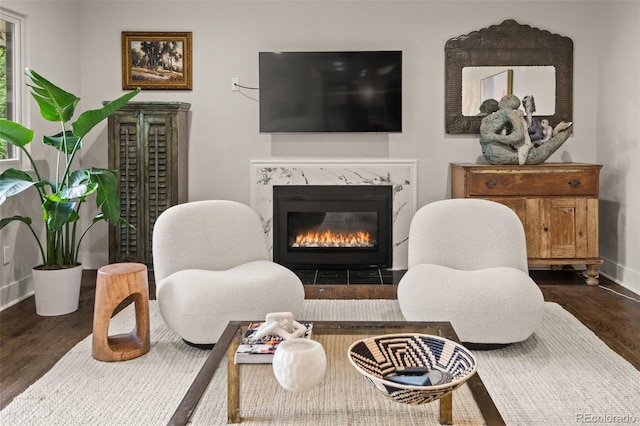 6128 S Coventry Ln E, Littleton, CO 80123 - living room featuring dark wood-style floors, a high end fireplace, and baseboards