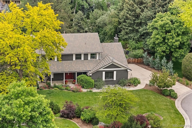6128 S Coventry Ln E, Littleton, CO 80123 - view of front facade with a chimney and a tiled roof