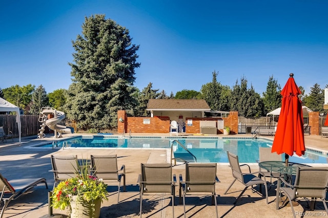 6128 S Coventry Ln E, Littleton, CO 80123 - community pool with a patio and a water slide