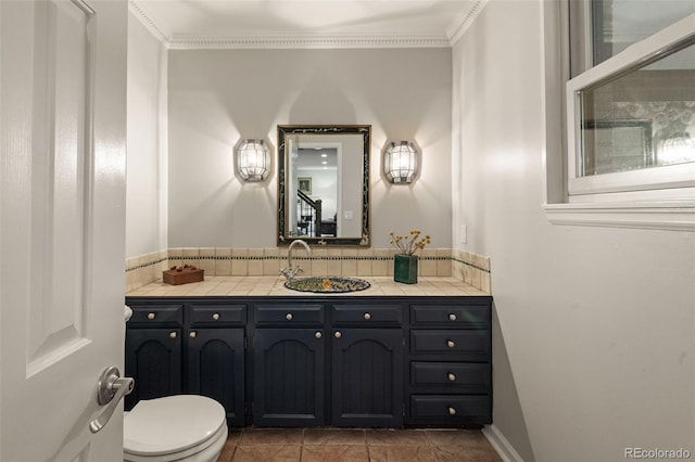 6128 S Coventry Ln E, Littleton, CO 80123 - bathroom with toilet, vanity, and crown molding