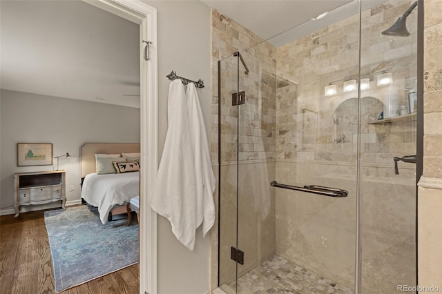 6128 S Coventry Ln E, Littleton, CO 80123 - bathroom featuring wood finished floors, ensuite bathroom, and a stall shower