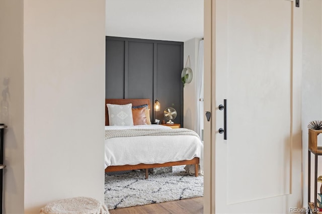 bedroom with wood finished floors