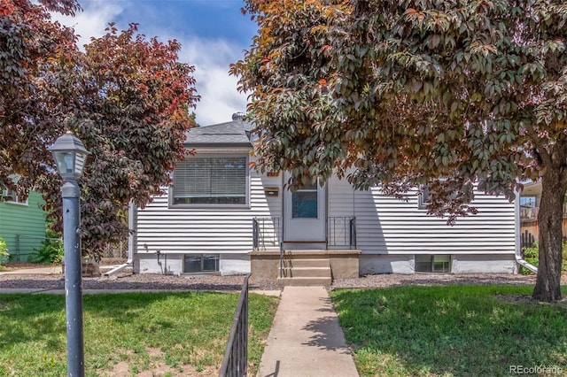 2845 Eaton St, Wheat Ridge, CO 80214 - obstructed view of property featuring a front lawn