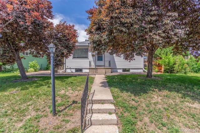 2845 Eaton St, Wheat Ridge, CO 80214 - obstructed view of property featuring a front lawn
