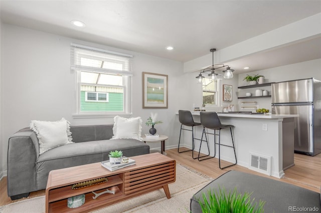2845 Eaton St, Wheat Ridge, CO 80214 - living area with light wood finished floors, plenty of natural light, and recessed lighting
