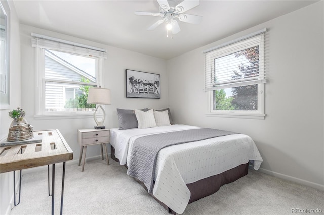 2845 Eaton St, Wheat Ridge, CO 80214 - bedroom with multiple windows, light carpet, and a ceiling fan