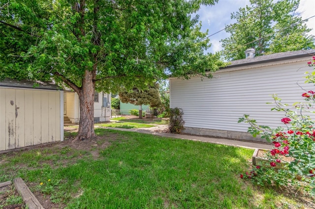 2845 Eaton St, Wheat Ridge, CO 80214 - view of green lawn with a storage shed