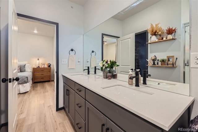 bathroom with vanity and hardwood / wood-style floors