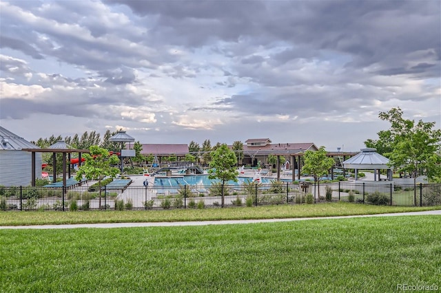 view of pool featuring a yard and a gazebo