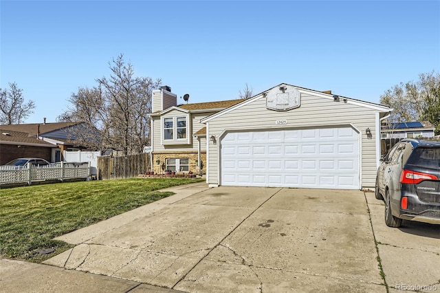 12425 Bellaire Dr, Thornton, CO 80241 - split level home featuring a chimney and driveway