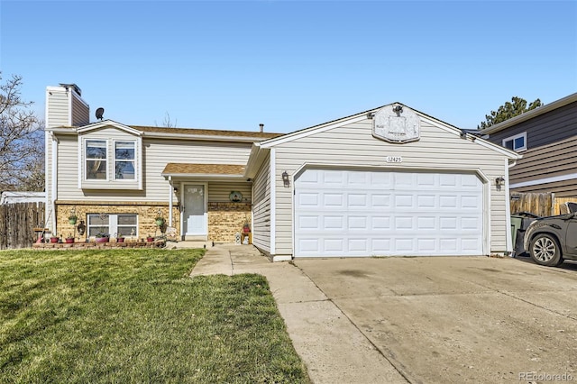 12425 Bellaire Dr, Thornton, CO 80241 - view of front facade with a garage, driveway, a chimney, and brick siding