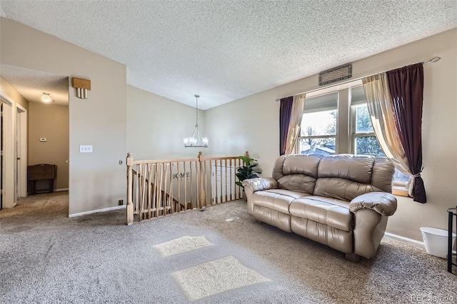 12425 Bellaire Dr, Thornton, CO 80241 - carpeted living room with a chandelier, a textured ceiling, lofted ceiling, and baseboards