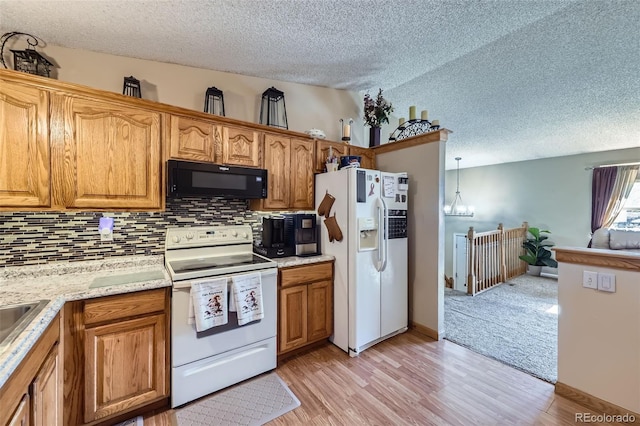 12425 Bellaire Dr, Thornton, CO 80241 - kitchen featuring white appliances, a textured ceiling, tasteful backsplash, light wood-style floors, and a chandelier