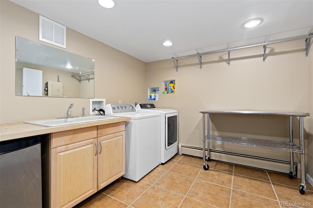 1952 Columbine Ct, Golden, CO 80401 - laundry area with washer and clothes dryer, light tile patterned floors, recessed lighting, and baseboard heating