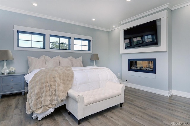 bedroom featuring crown molding and wood-type flooring