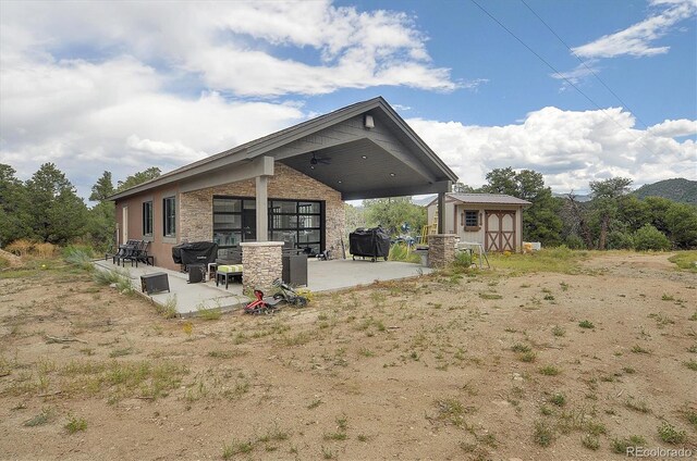 back of property featuring a patio