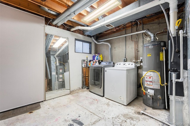 clothes washing area with water heater and washing machine and clothes dryer