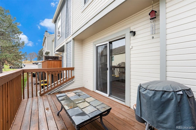 wooden deck featuring grilling area