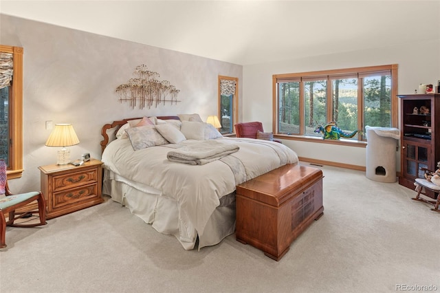 bedroom with light colored carpet, visible vents, and baseboards