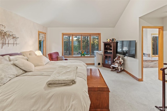 bedroom featuring vaulted ceiling, carpet flooring, and baseboards