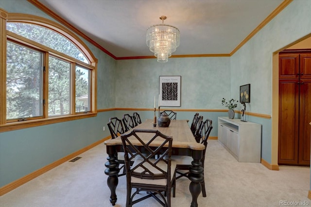 2828 Keystone Dr, Evergreen, CO 80439 - dining space with light colored carpet, crown molding, a chandelier, and baseboards