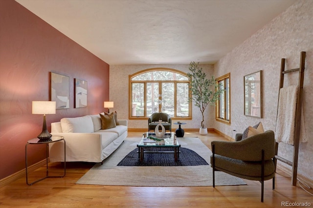 2828 Keystone Dr, Evergreen, CO 80439 - living room featuring wallpapered walls, baseboards, and wood finished floors