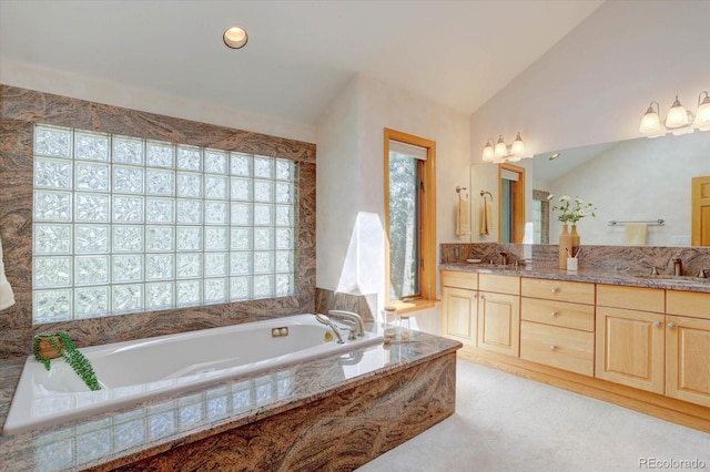 2828 Keystone Dr, Evergreen, CO 80439 - bathroom with healthy amount of natural light, double vanity, a bath, and lofted ceiling