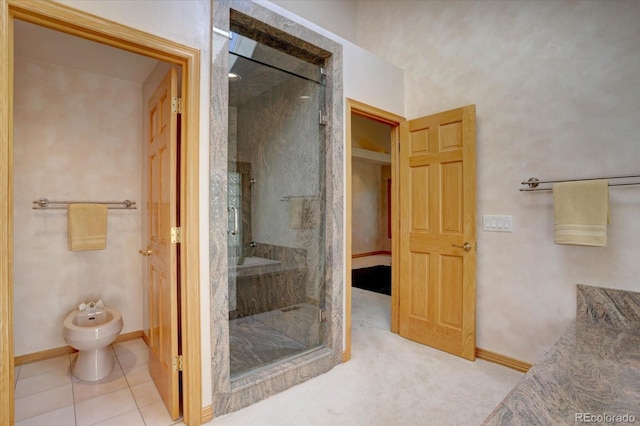 2828 Keystone Dr, Evergreen, CO 80439 - bathroom featuring a bidet, a shower stall, and baseboards