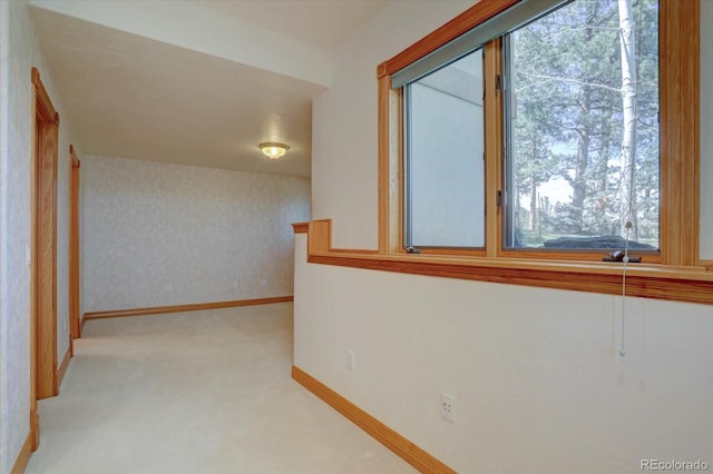 2828 Keystone Dr, Evergreen, CO 80439 - hallway featuring plenty of natural light, carpet flooring, and baseboards