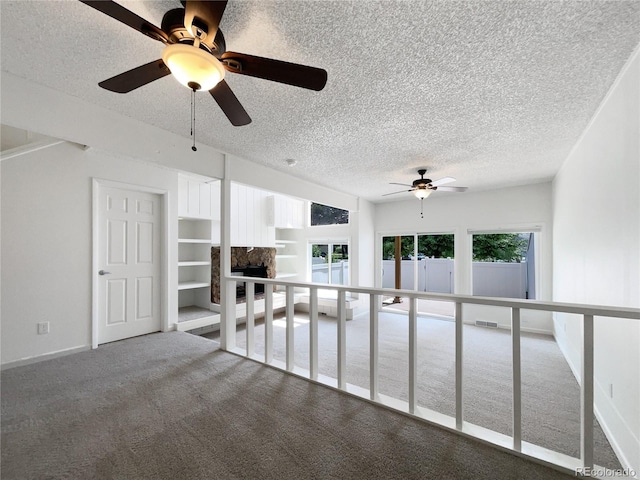 1925 28th Ave Unit 34, Greeley, CO 80634 - carpeted empty room featuring ceiling fan and a textured ceiling