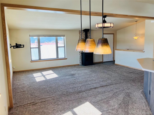 interior space featuring baseboards and carpet