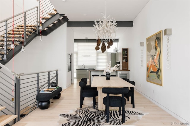 dining room featuring a chandelier and light hardwood / wood-style floors