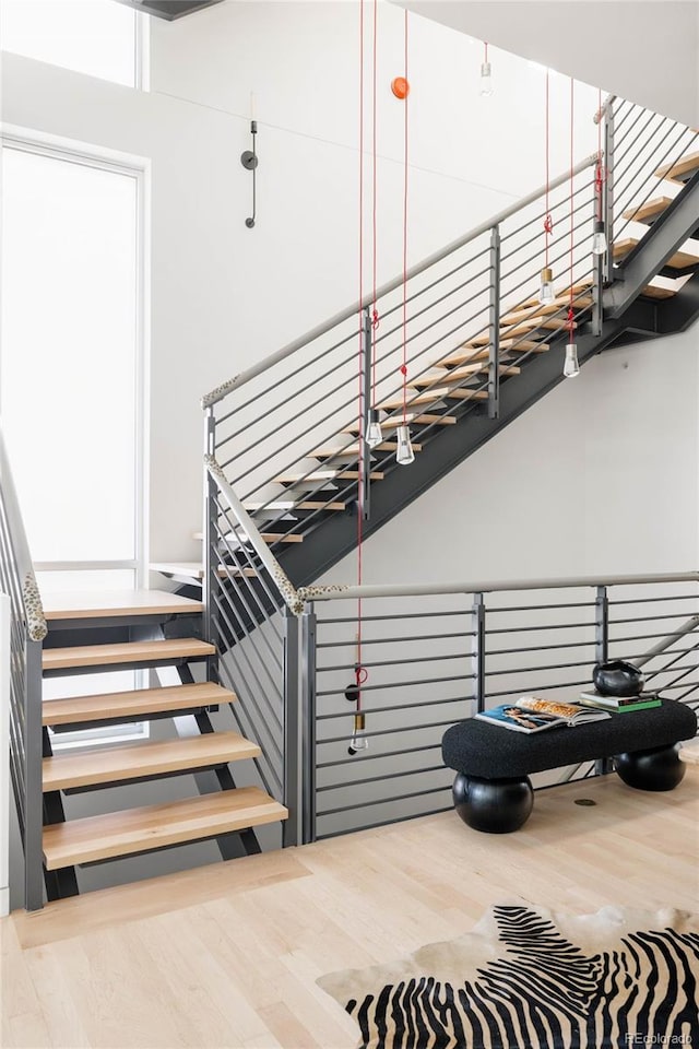 stairway featuring hardwood / wood-style flooring