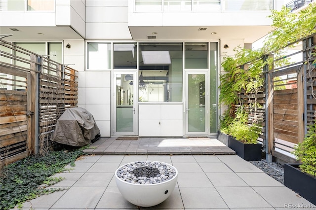 doorway to property featuring a patio