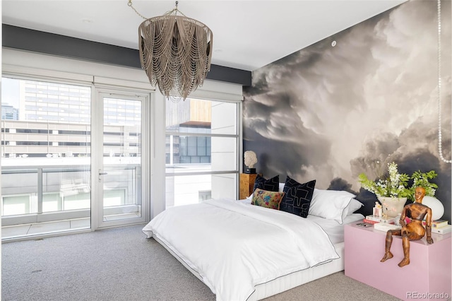 carpeted bedroom featuring access to outside