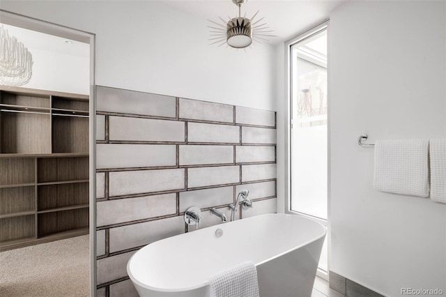 full bathroom featuring a soaking tub