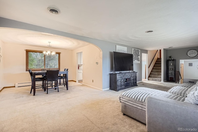 11290 W 77th Dr, Arvada, CO 80005 - living area with arched walkways, carpet flooring, stairway, baseboard heating, and a chandelier