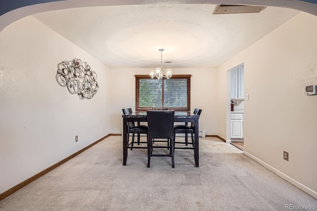 11290 W 77th Dr, Arvada, CO 80005 - dining area with arched walkways, light carpet, and a chandelier
