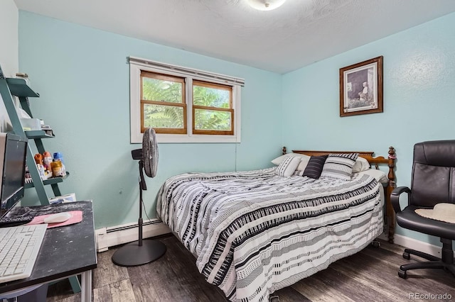 11290 W 77th Dr, Arvada, CO 80005 - bedroom with a baseboard heating unit and wood finished floors