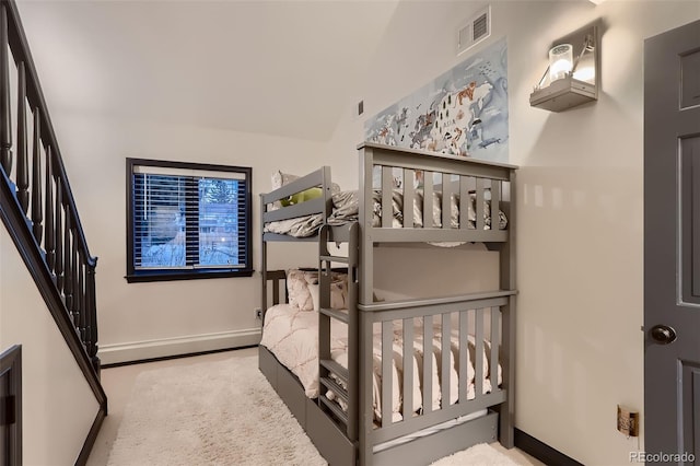 bedroom with visible vents and baseboards