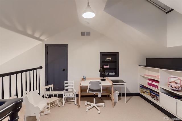 carpeted office space with visible vents and vaulted ceiling