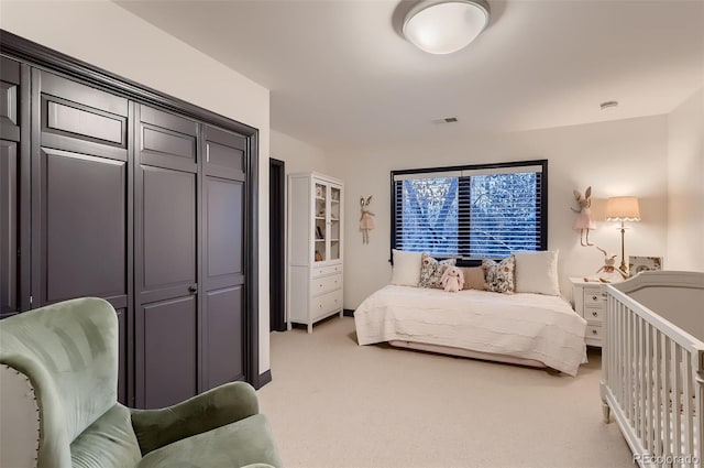 bedroom with light carpet