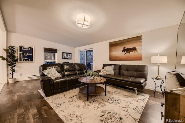 living room featuring lofted ceiling, baseboard heating, dark wood-style floors, and baseboards