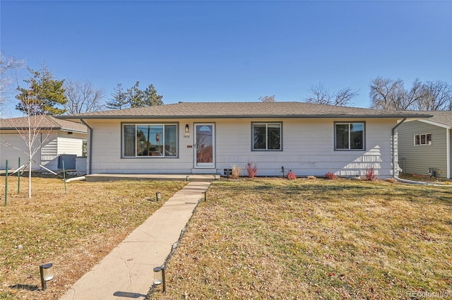 single story home featuring a front yard